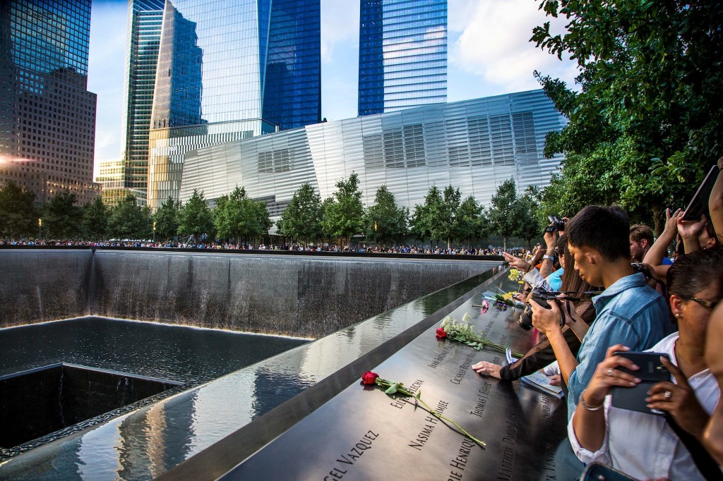 Visitors laid flowers on the 9/11 Memorial to remember the victims who lost their lives in the attacks. 
