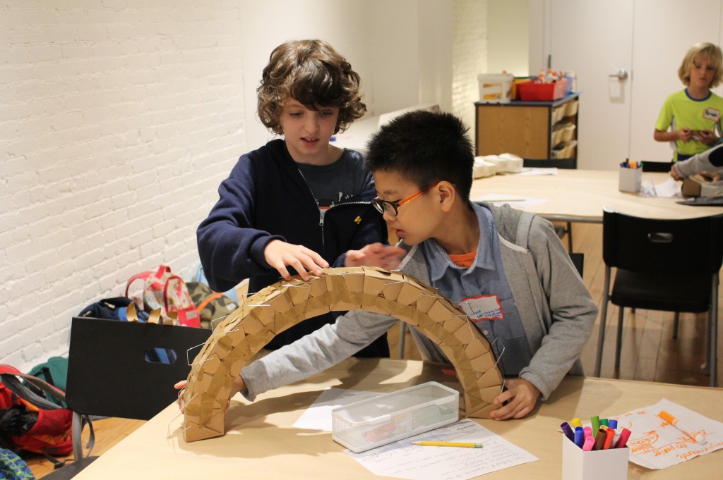 Graham and John constructing an arch bridge in our elementary school Building Bridges program. Credit: Center for Architecture.