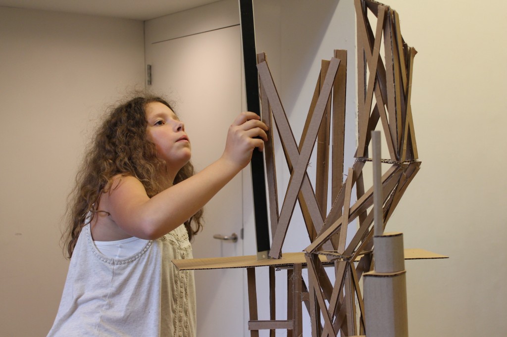 Anna constructing her final model for our middle school Skyscrapers program. Credit: Center for Architecture