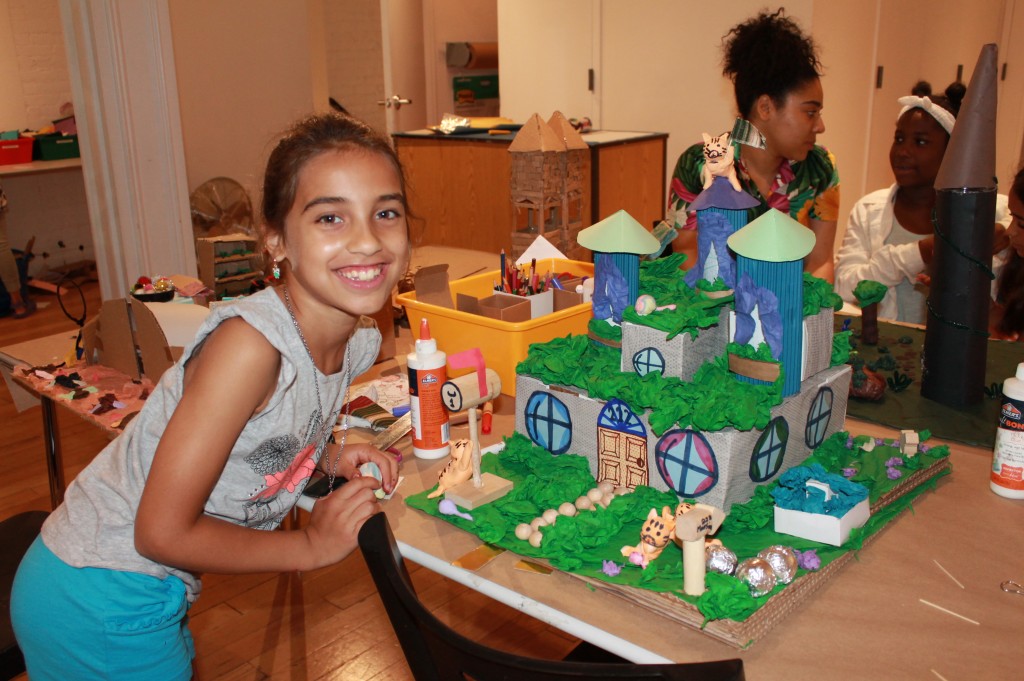 Sonali from our elementary school Fairytale Architecture program shows off her castle design. Credit: Center for Architecture.